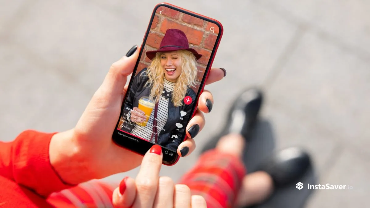 A phone playing a short-form vertical video with a creator, caption, and music