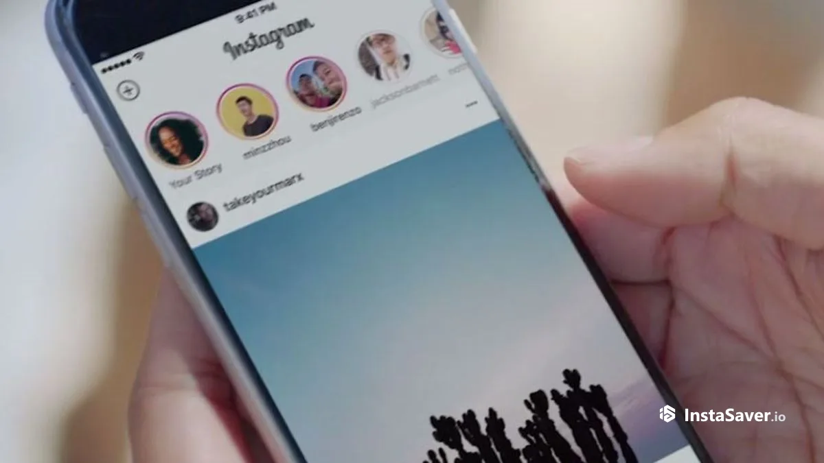 A phone showing the Instagram Stories tray and feed